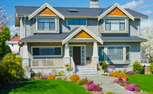 home with nicely trimmed and landscaped front yard