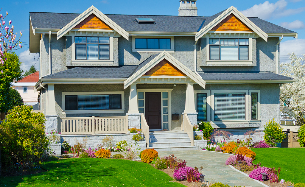 home with nicely trimmed and landscaped front yard