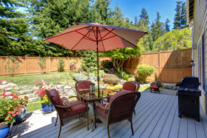 Beautiful landscape design for backyard garden and patio area on walkout deck