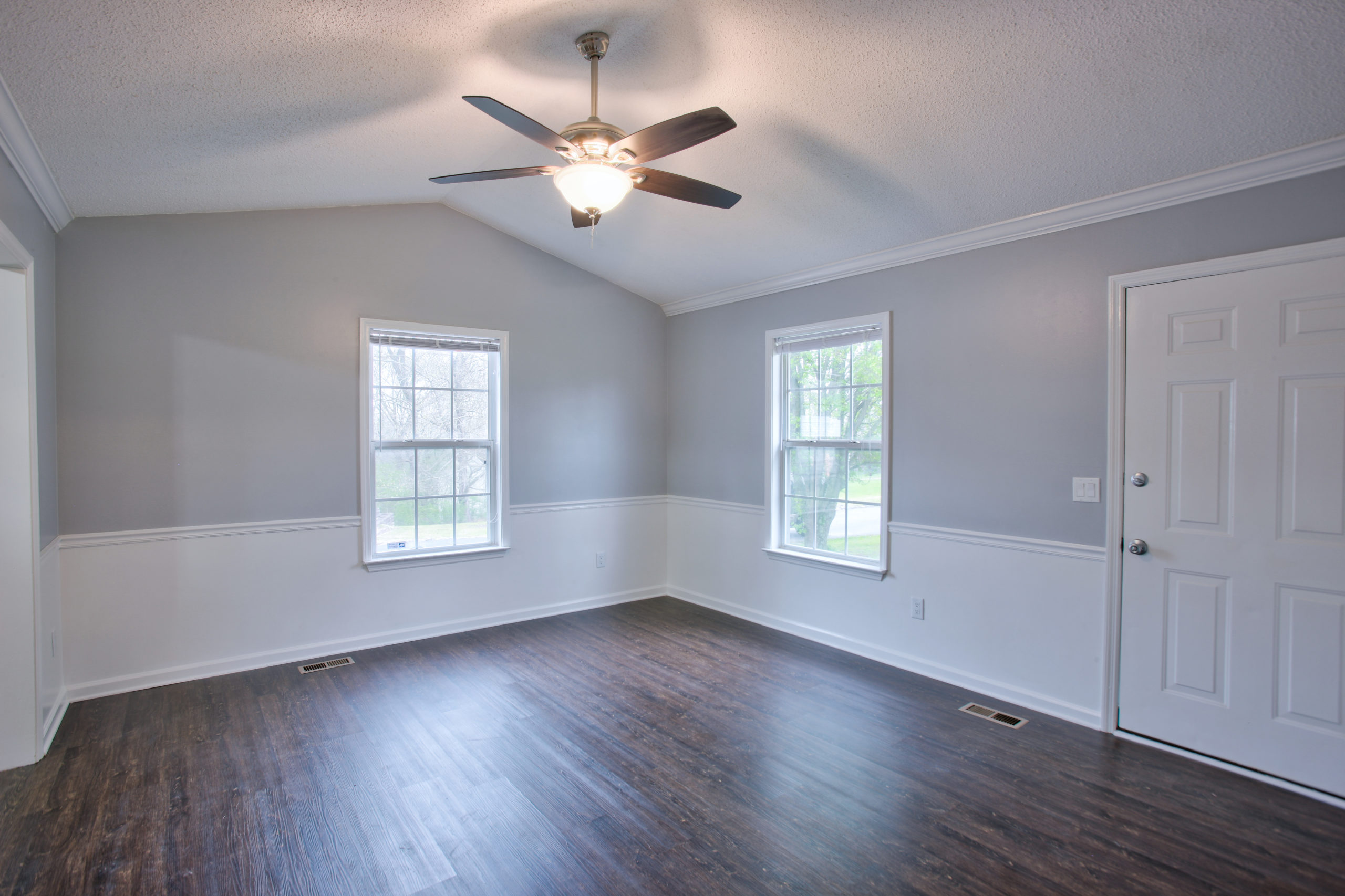 Gray Living Room Interior With Vaulted Ceilings And Chair Rail Better Homes And Gardens Real Estate Life