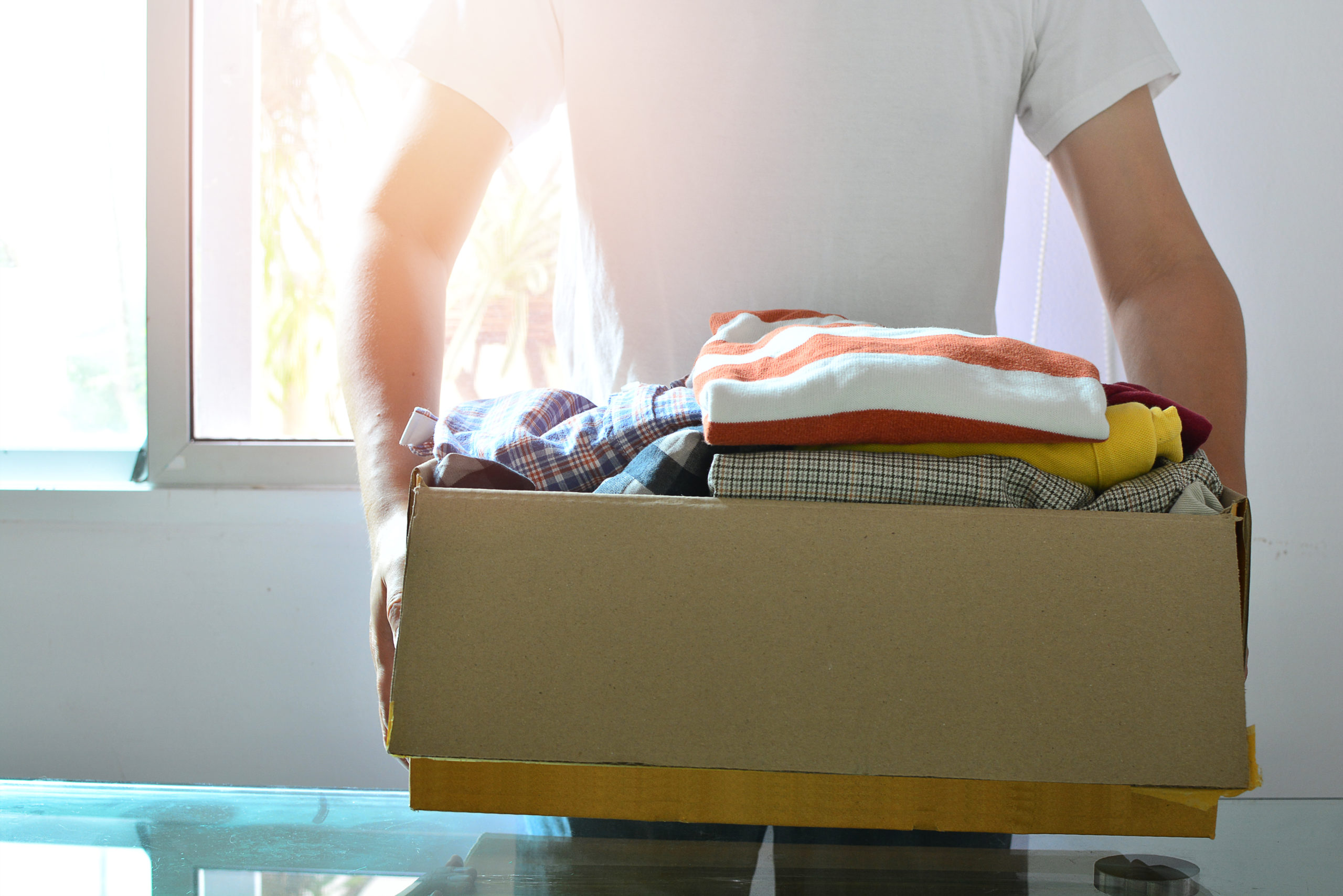 man carrying a box