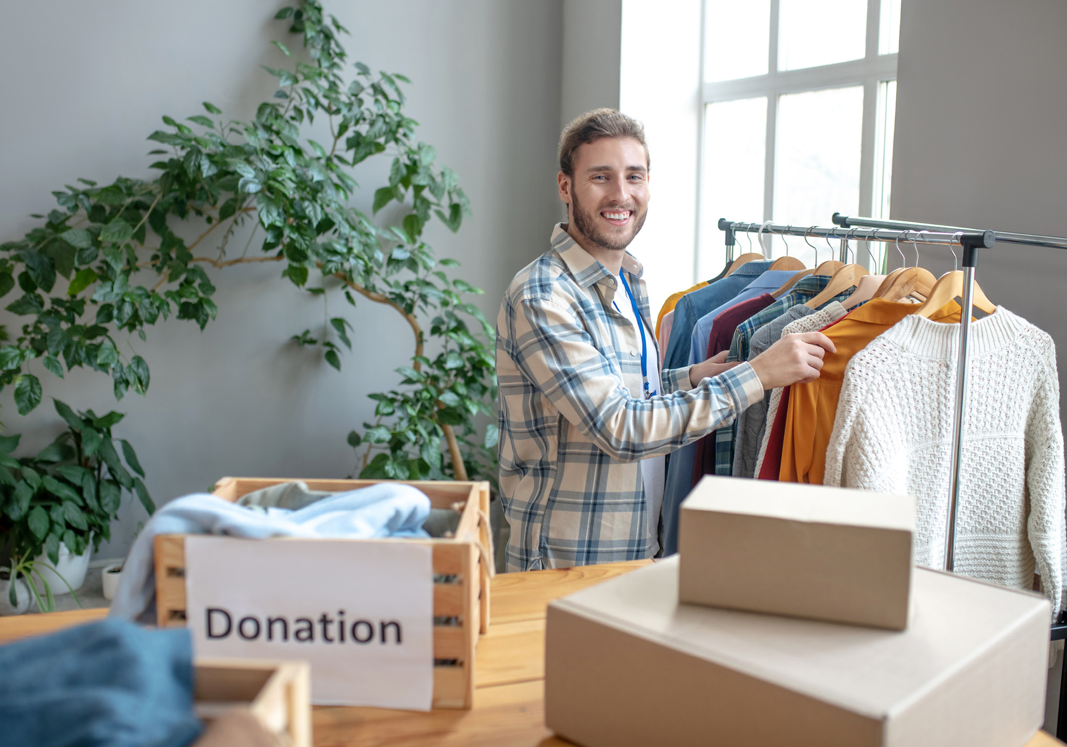 man donating shirts