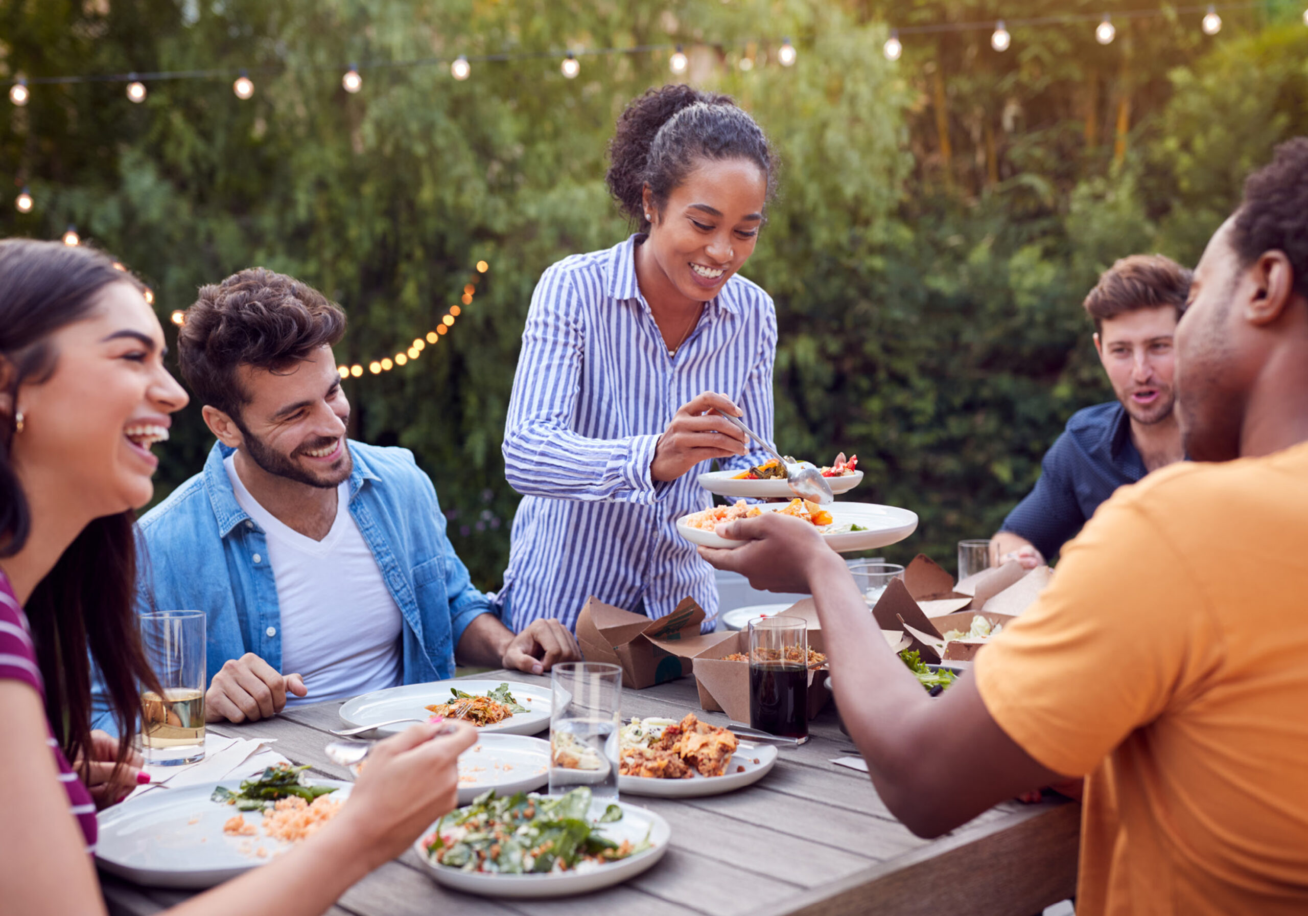 people eating together outdoors