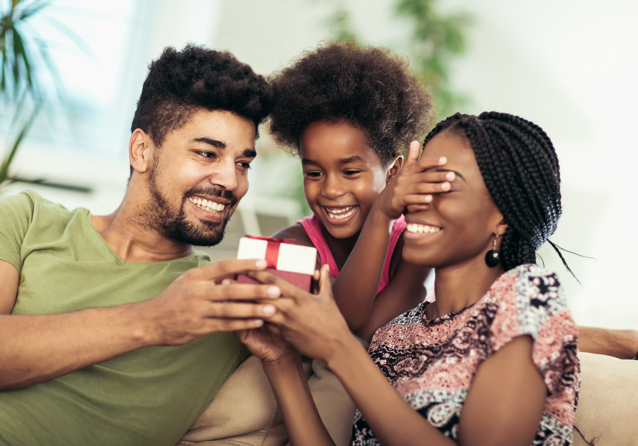 family giving gift to mother