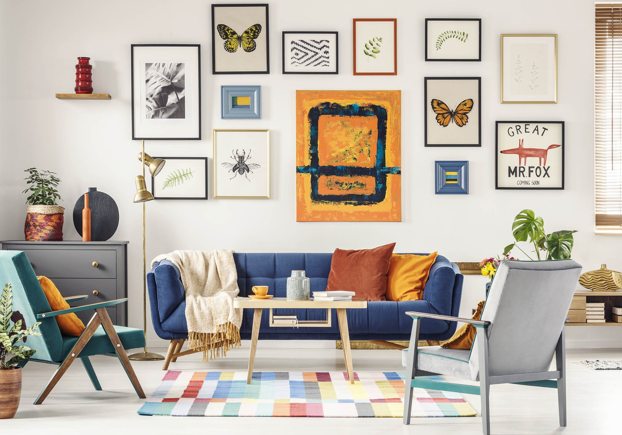 living room with many frames hanging on the wall