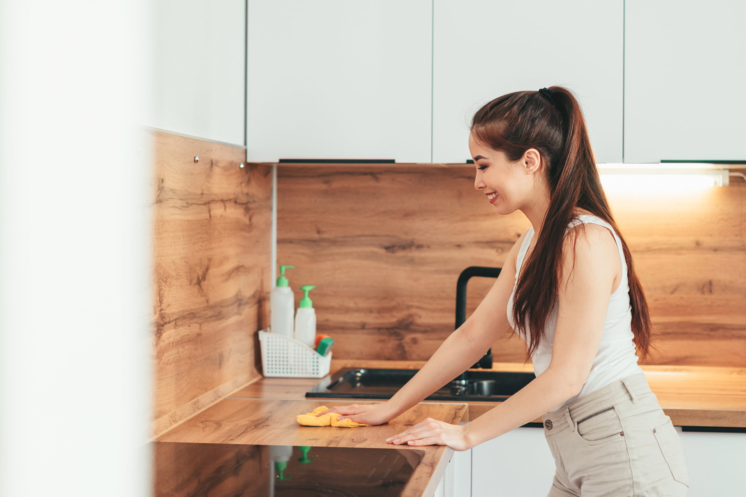 woman cleaning kitchen