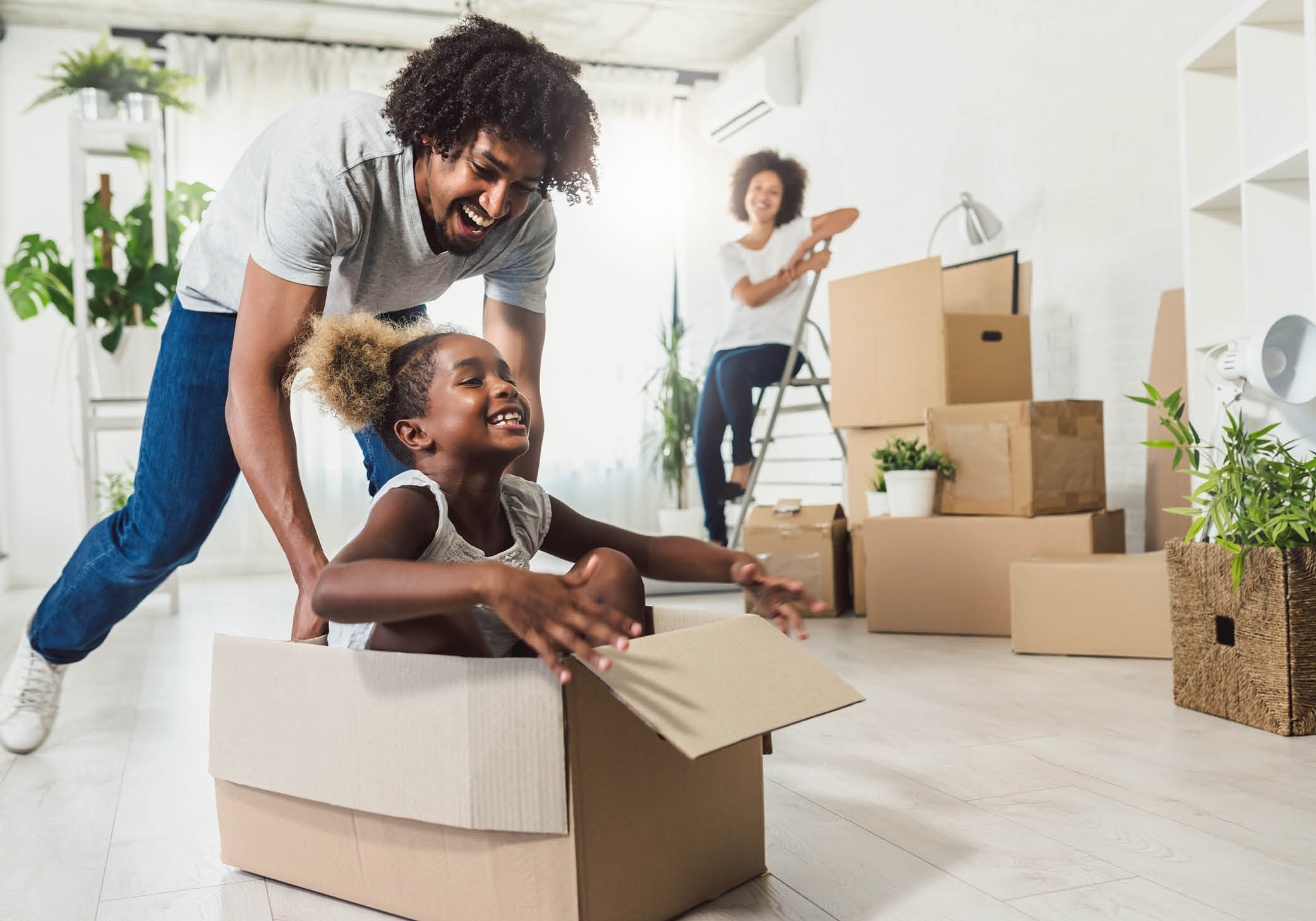Family preparing boxes for moving