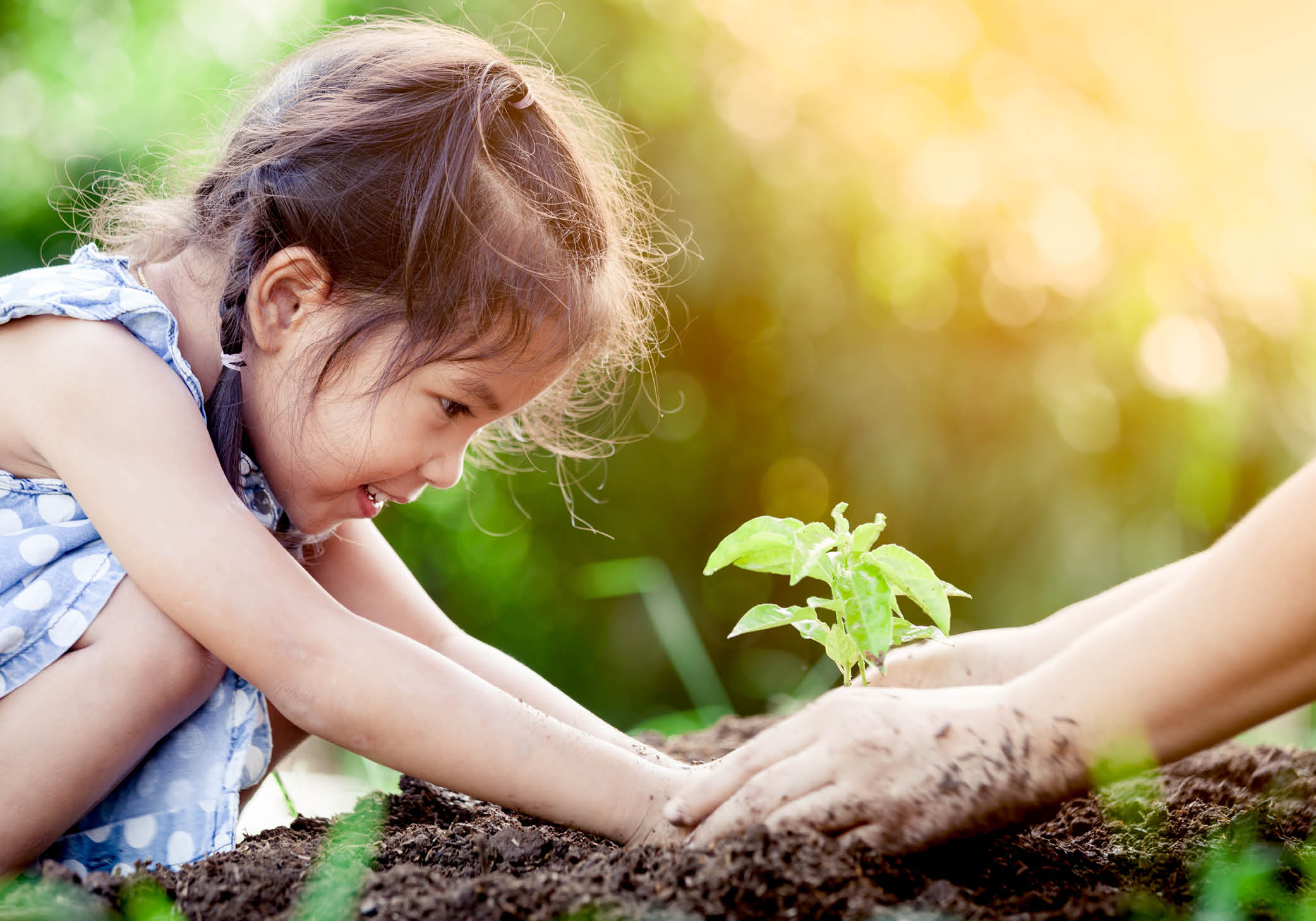 Woman and child working on the garden